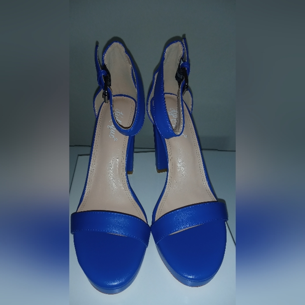 Brand new blue leather platform heel.  KyNique is a new brand sizes 8-11.